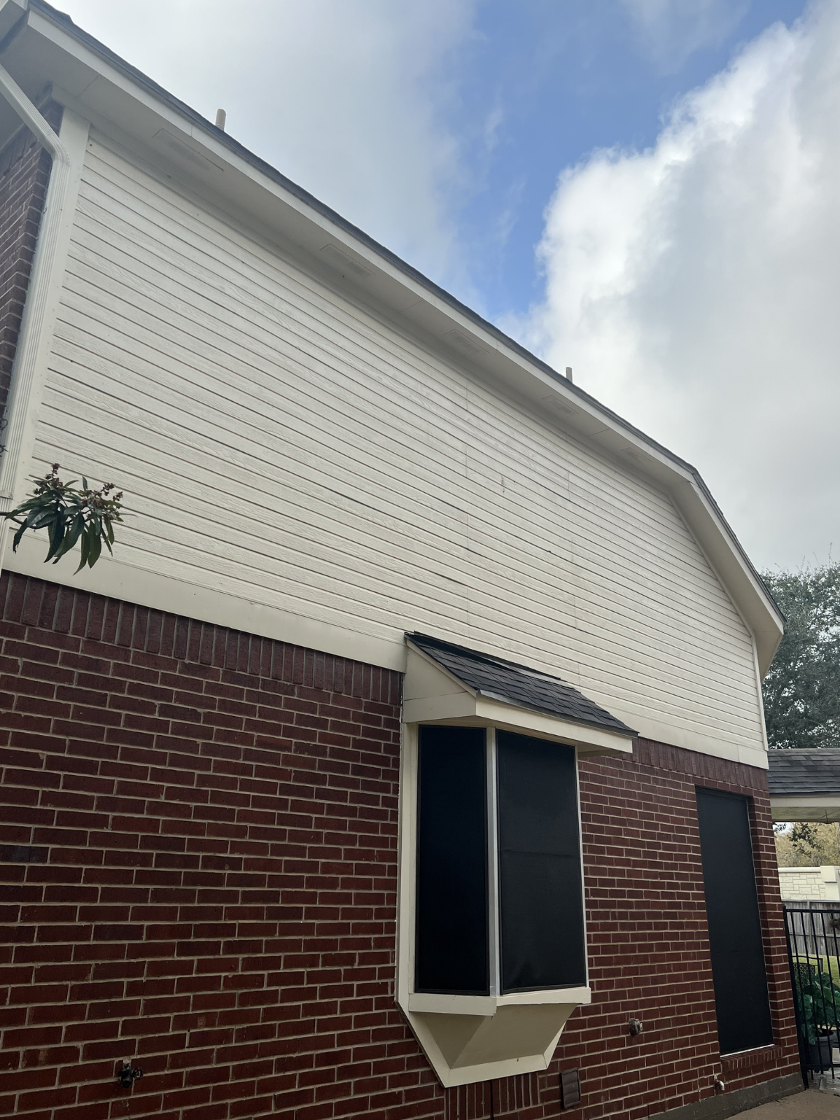 Before and after roof cleaning showing tile roof restored with soft washing in Texas
